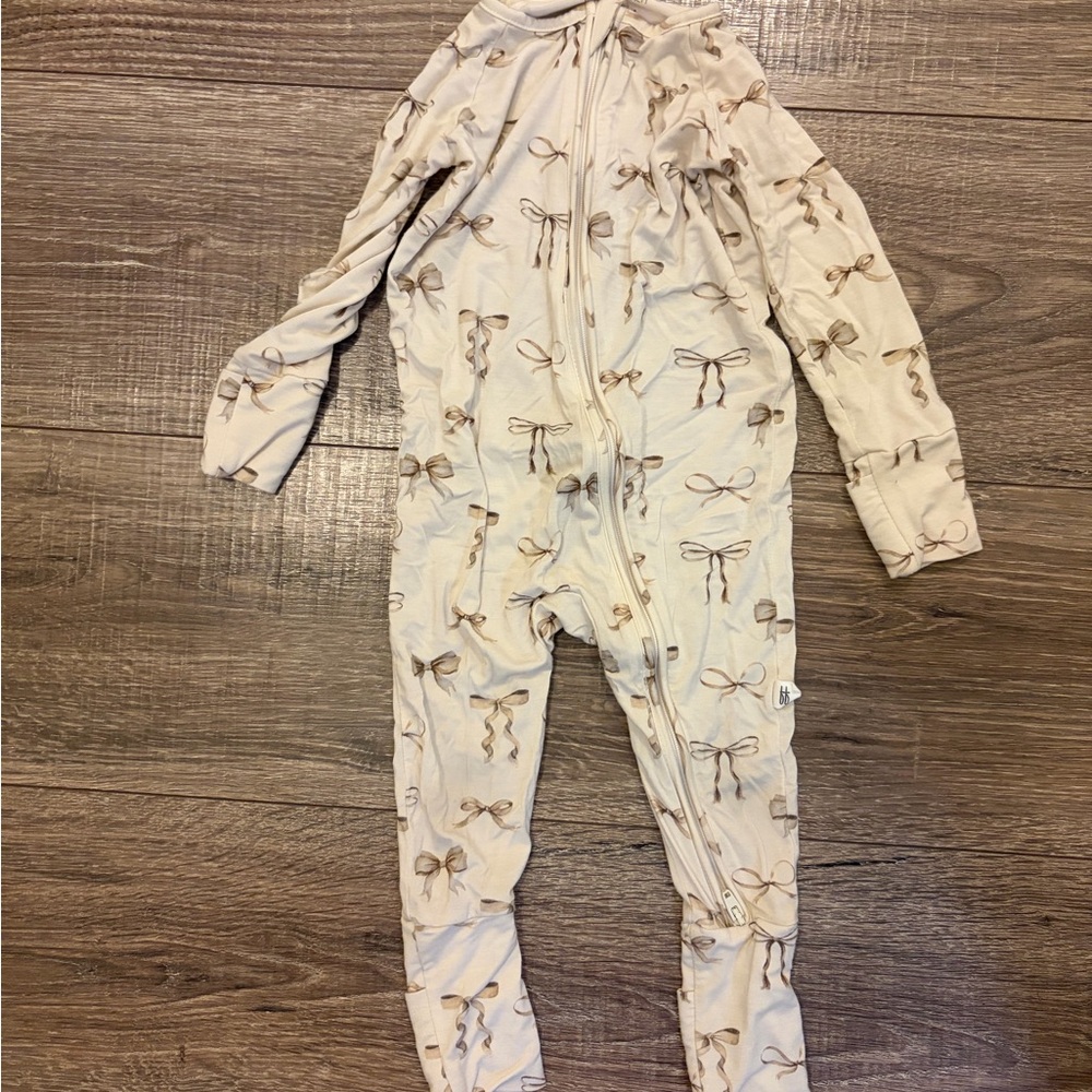 Cream Footie with Bow Pattern